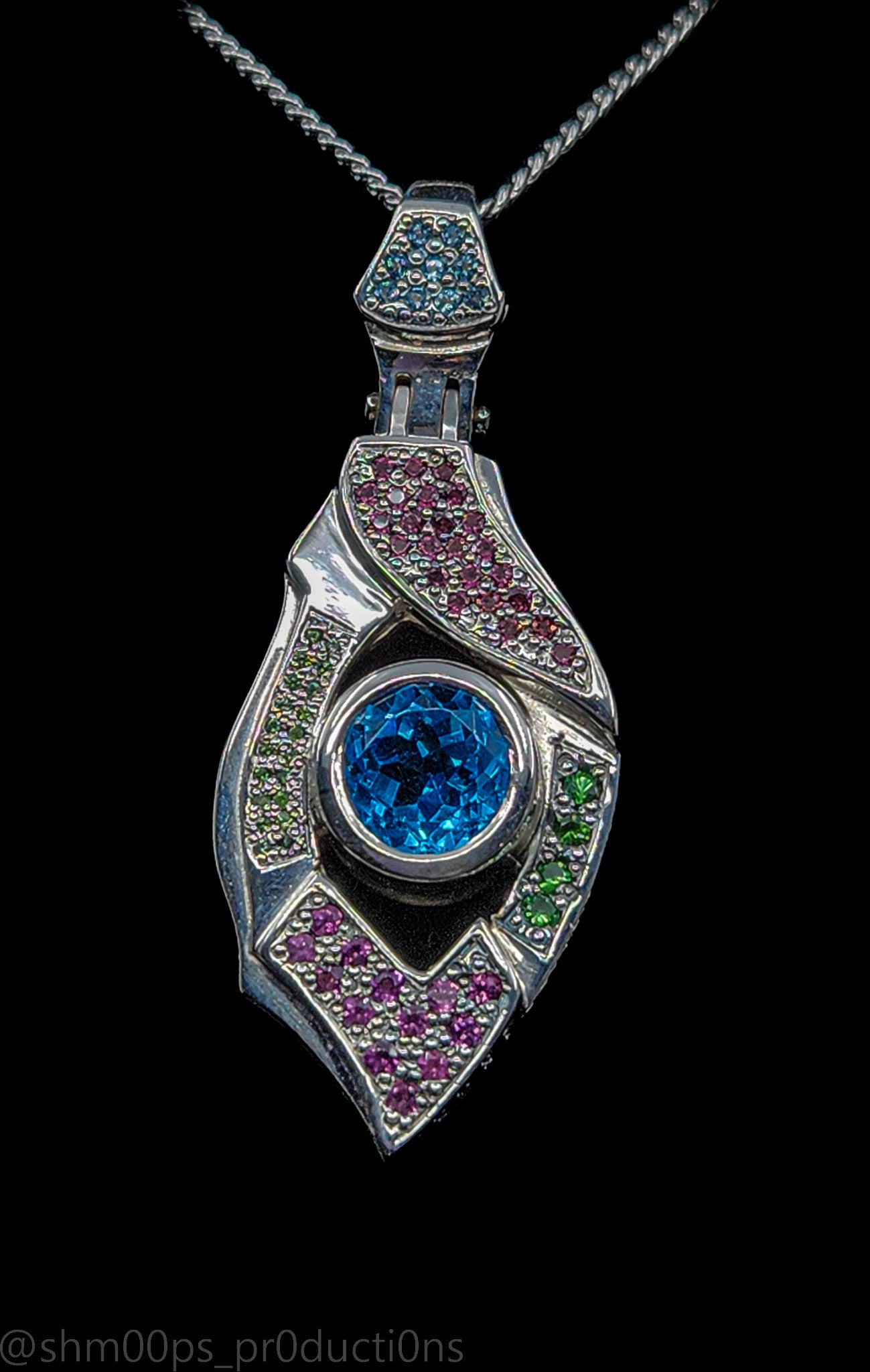 "Xenon's Abyssal Elegance" Sterling silver Topaz pendant with Rhodolite, Tsavorite, and sapphire accents