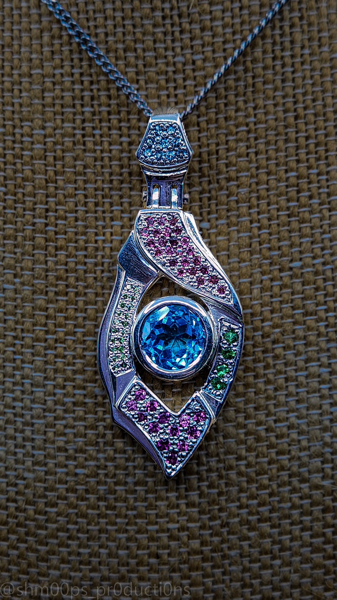 "Xenon's Abyssal Elegance" Sterling silver Topaz pendant with Rhodolite, Tsavorite, and sapphire accents