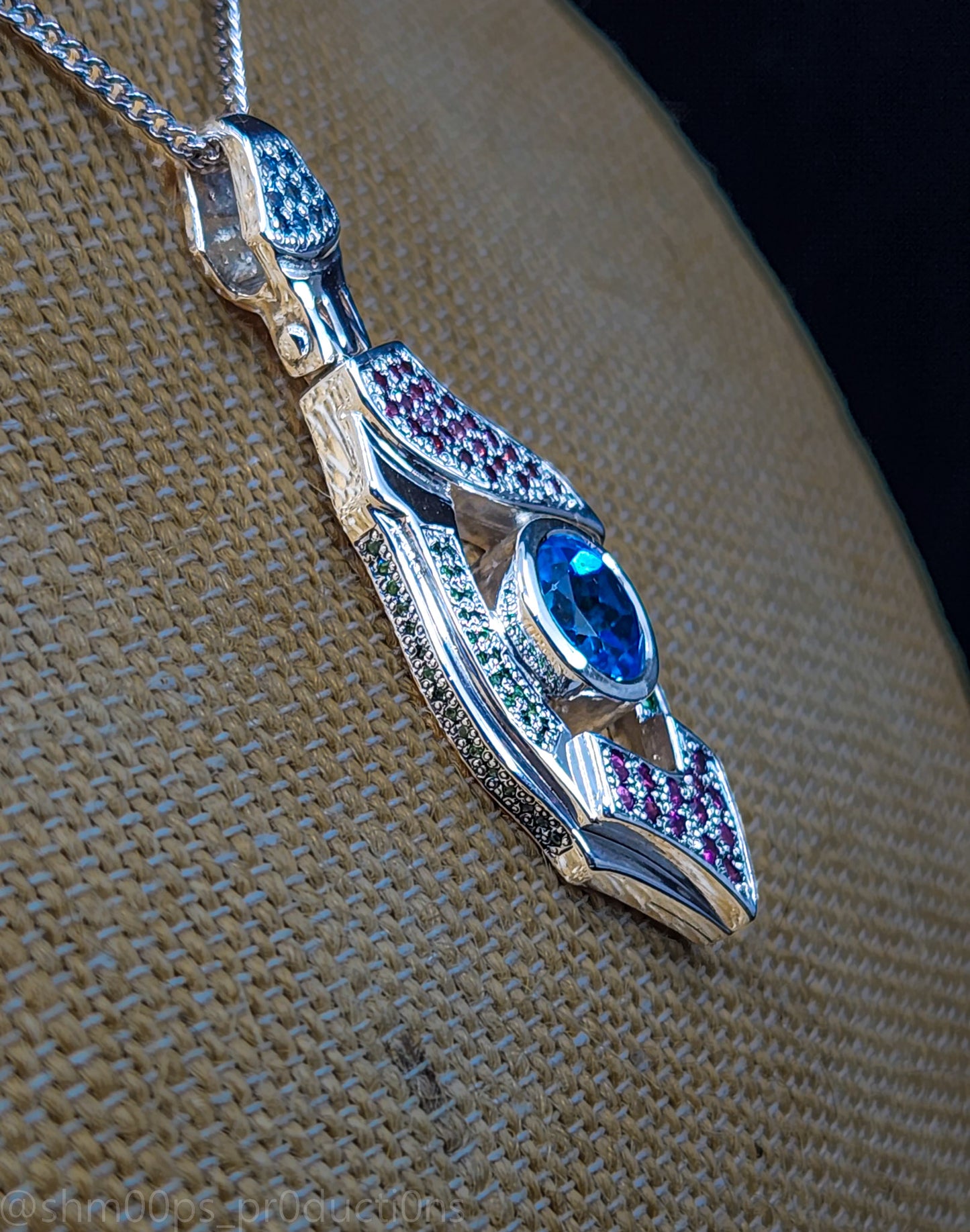 "Xenon's Abyssal Elegance" Sterling silver Topaz pendant with Rhodolite, Tsavorite, and sapphire accents