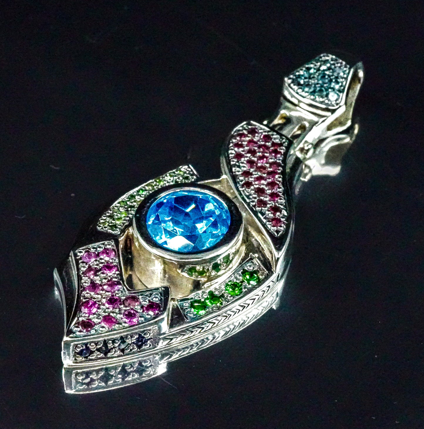 "Xenon's Abyssal Elegance" Sterling silver Topaz pendant with Rhodolite, Tsavorite, and sapphire accents