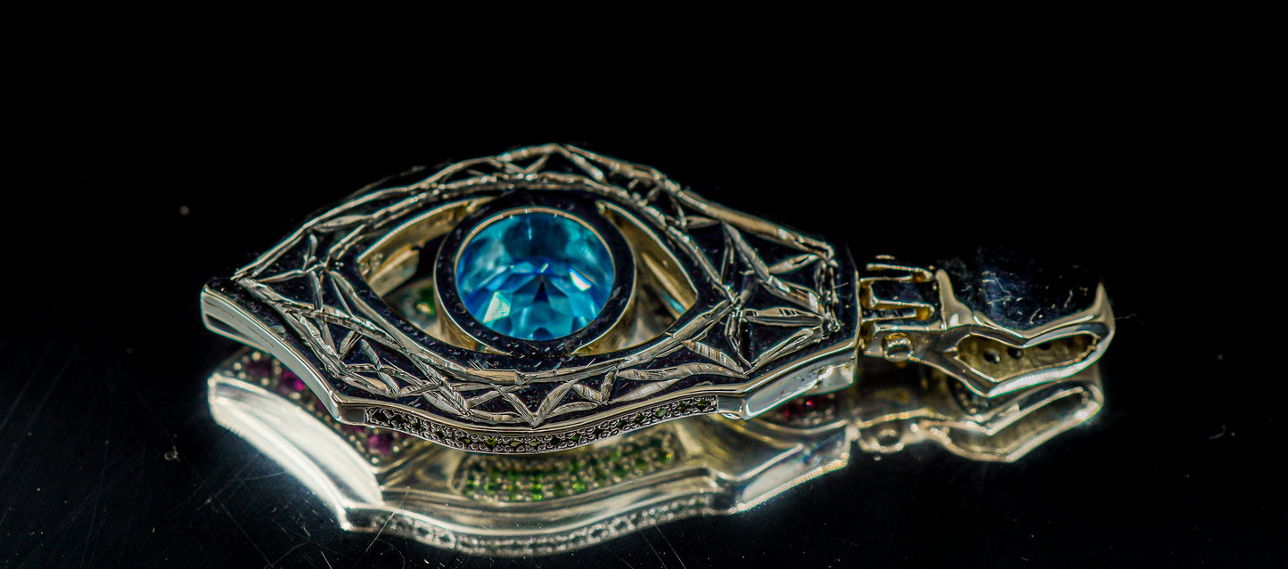 "Xenon's Abyssal Elegance" Sterling silver Topaz pendant with Rhodolite, Tsavorite, and sapphire accents